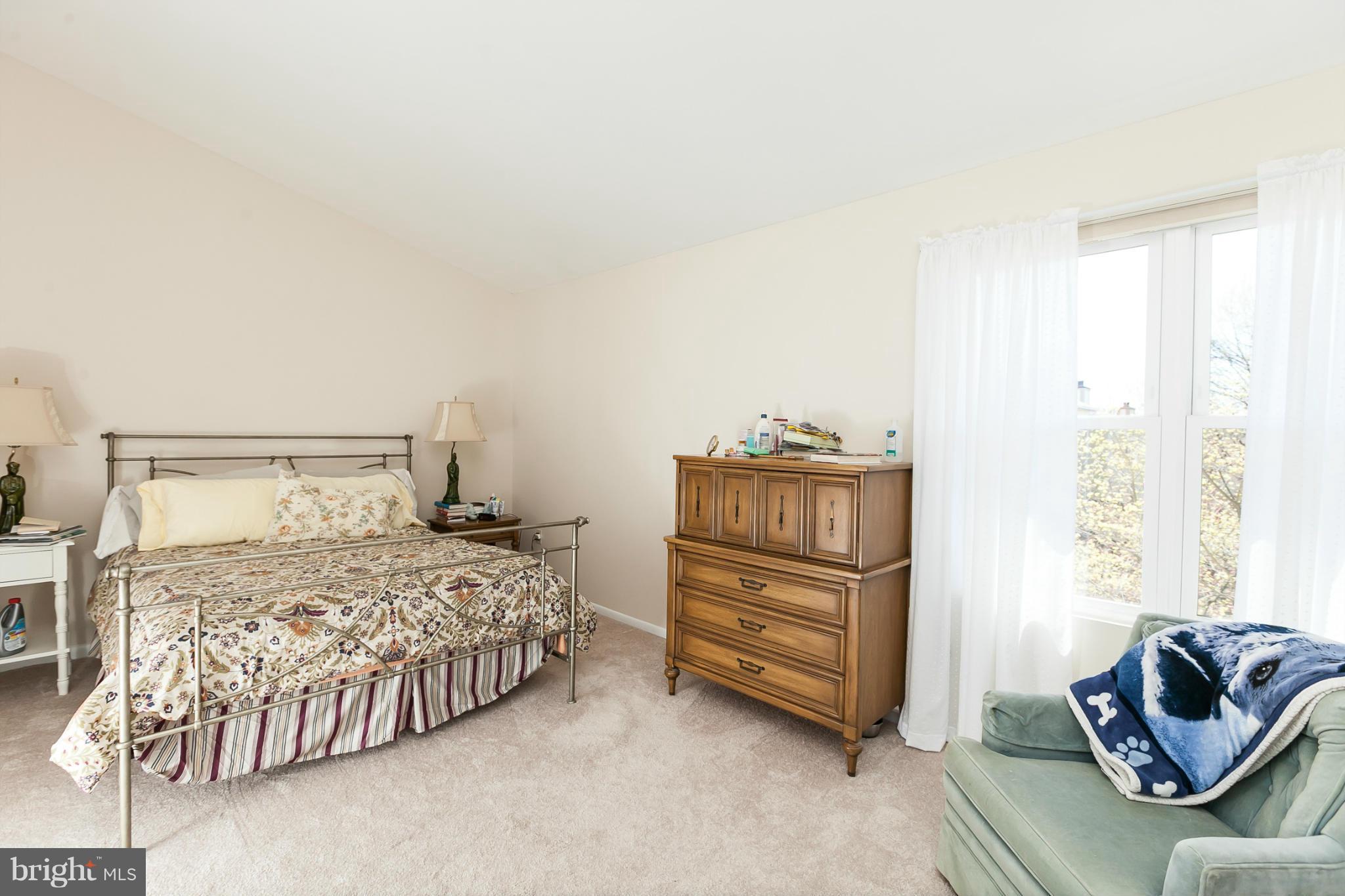 2846 Schoolhouse Circle Silver Spring, MD 20902 - Photo 16 of 28 a bedroom with a bed and a couch