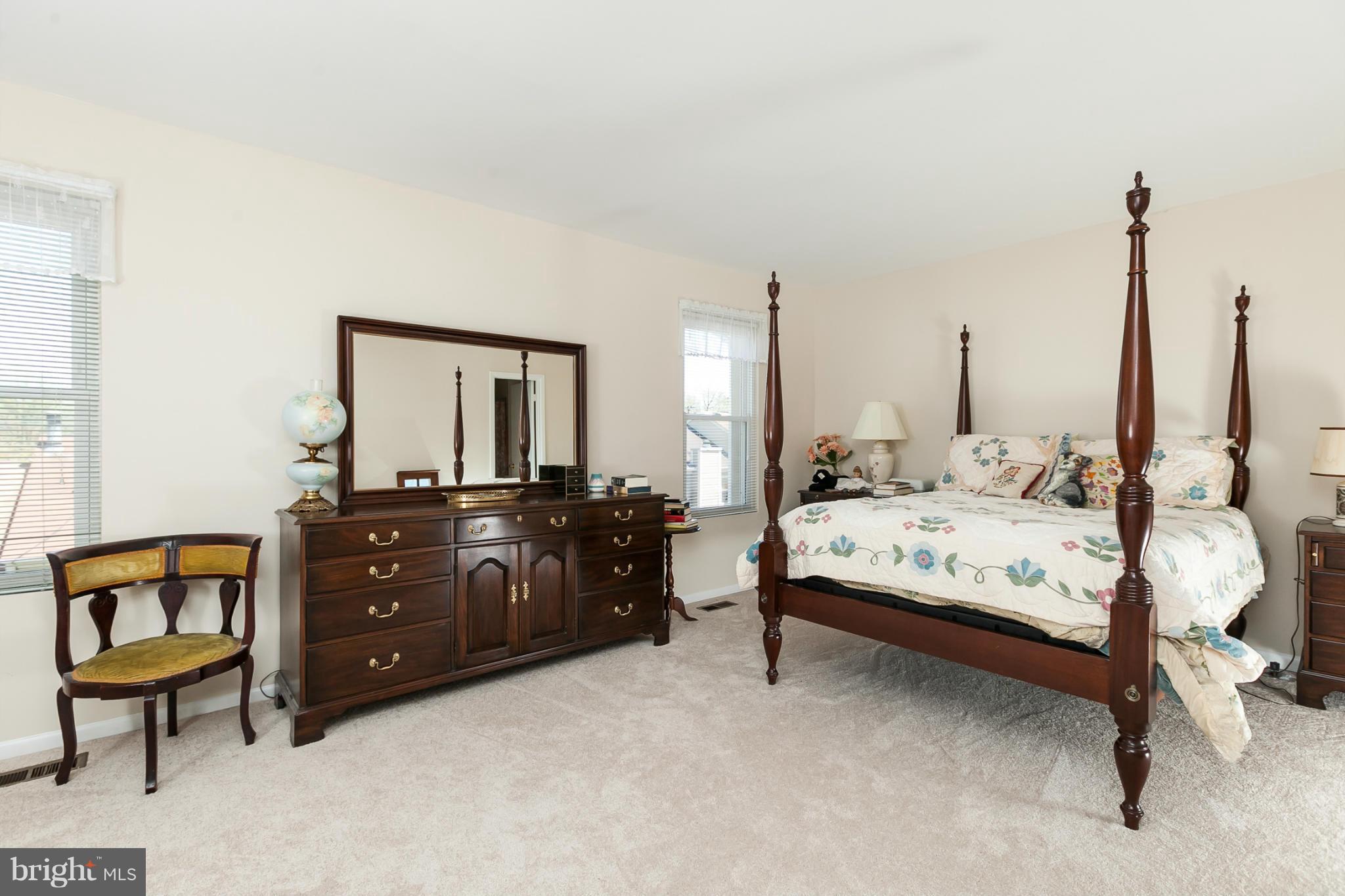 2846 Schoolhouse Circle Silver Spring, MD 20902 - Photo 20 of 28 a bedroom with a bed and a dresser