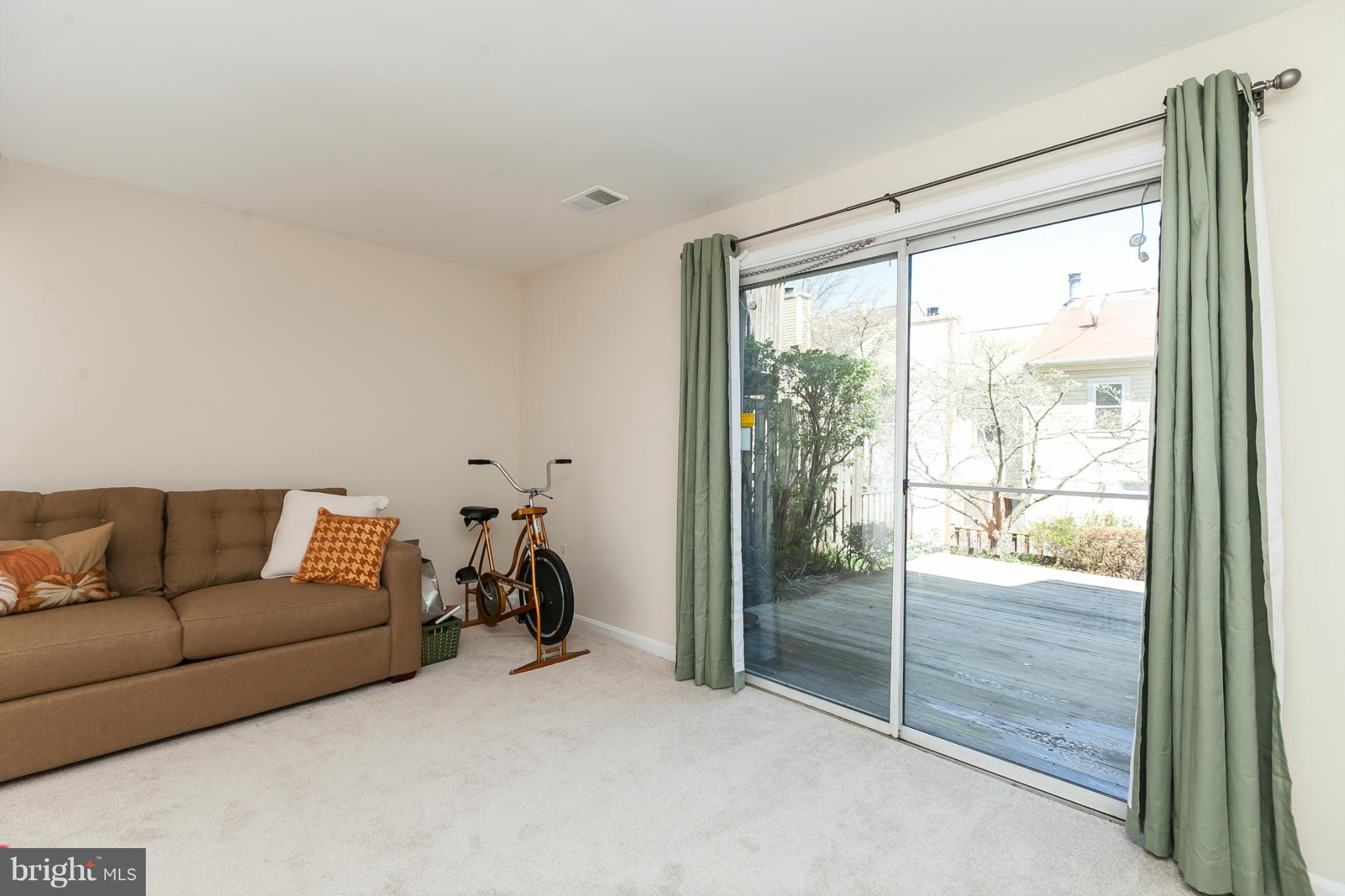 2846 Schoolhouse Circle Silver Spring, MD 20902 - Photo 23 of 28 a living room with furniture and a glass door