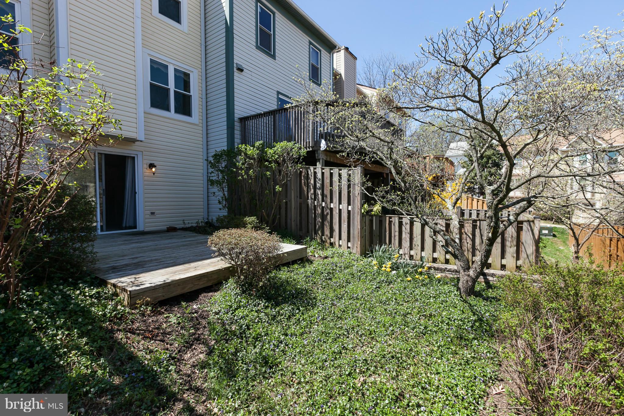 2846 Schoolhouse Circle Silver Spring, MD 20902 - Photo 25 of 28 a garden with trees in front of it