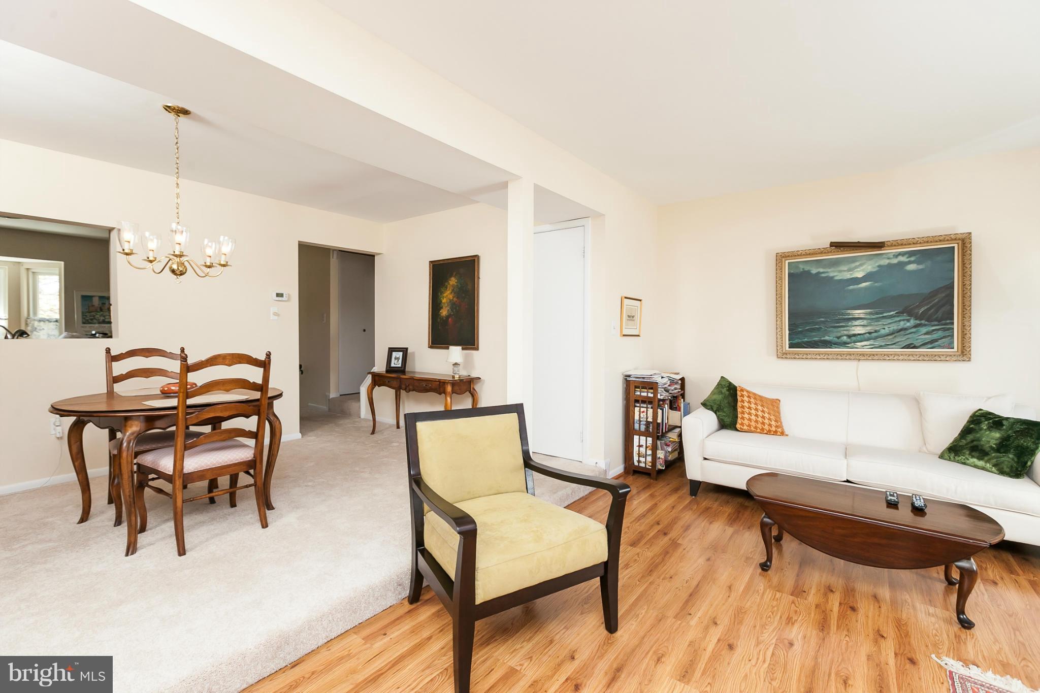 2846 Schoolhouse Circle Silver Spring, MD 20902 - Photo 7 of 28 a living room with furniture a table and wooden floor