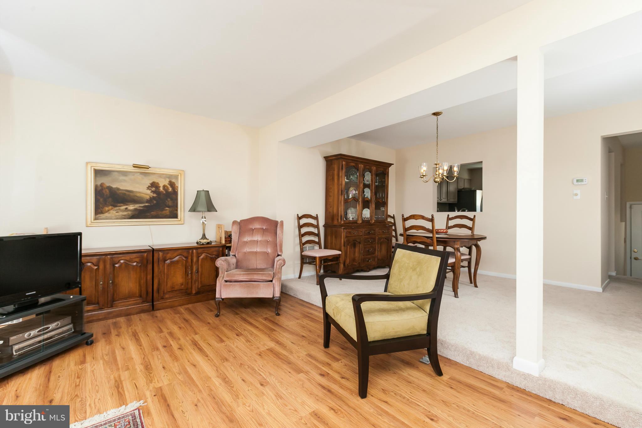 2846 Schoolhouse Circle Silver Spring, MD 20902 - Photo 9 of 28 a living room with furniture and a flat screen tv