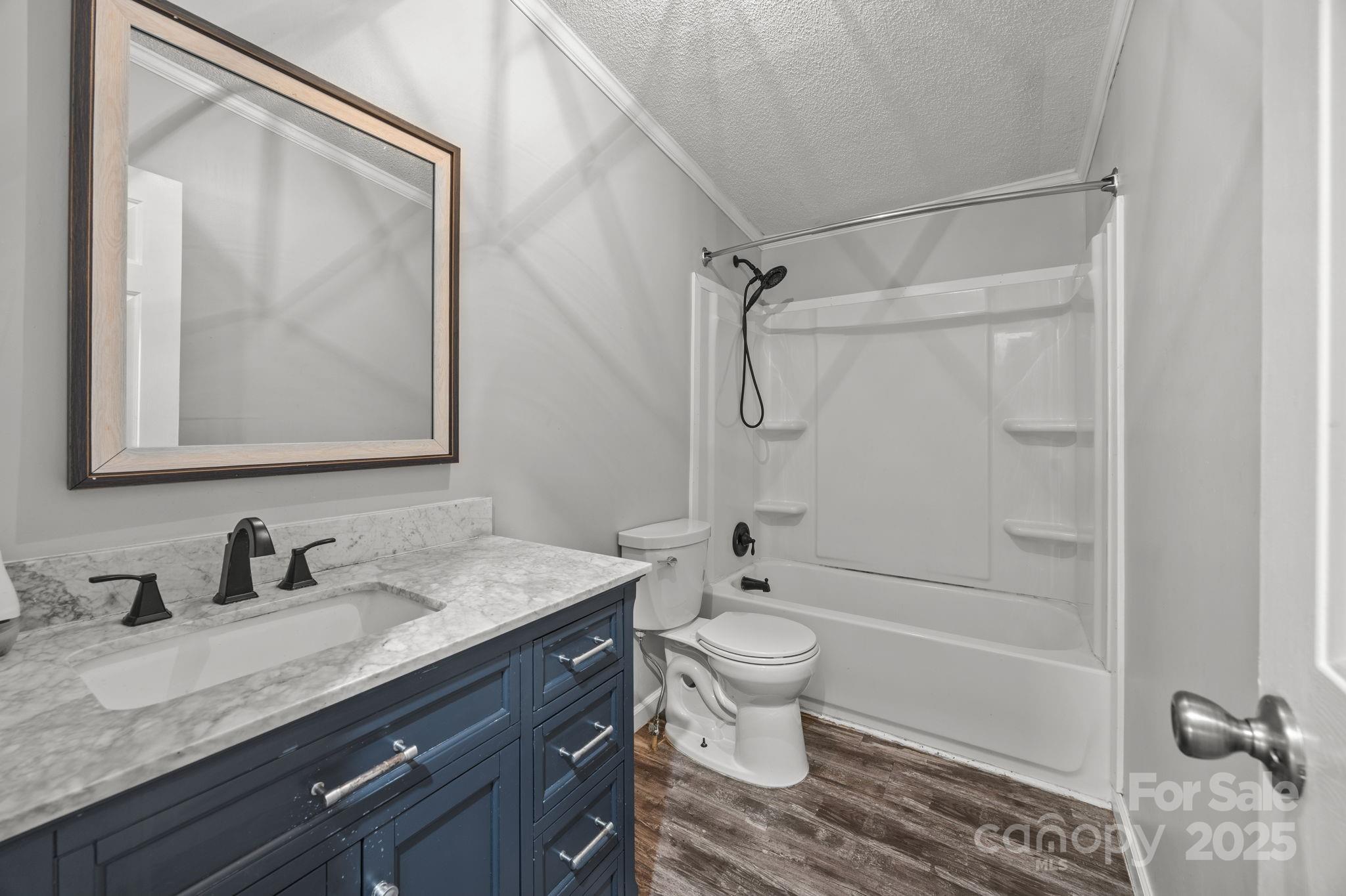 21465 Old Beatty Ford Road Richfield, NC 28137 - Photo 21 of 41 a bathroom with a granite countertop sink toilet and shower