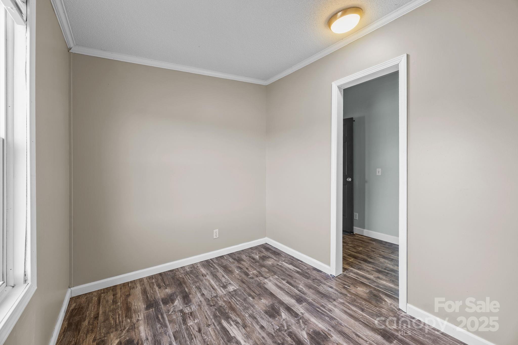 21465 Old Beatty Ford Road Richfield, NC 28137 - Photo 27 of 41 a view of an empty room and wooden floor