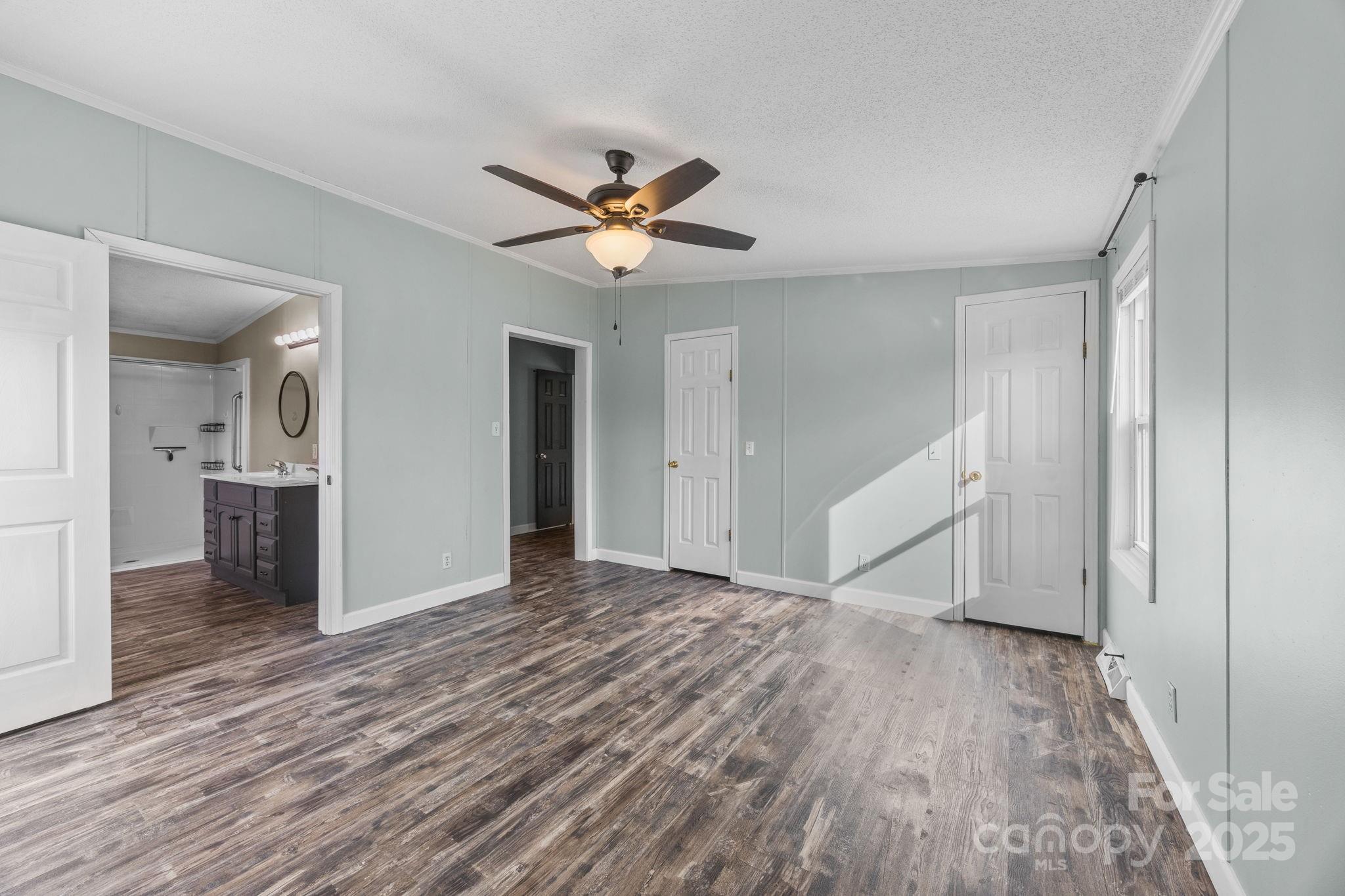 21465 Old Beatty Ford Road Richfield, NC 28137 - Photo 29 of 41 wooden floor in an empty room with a bathroom