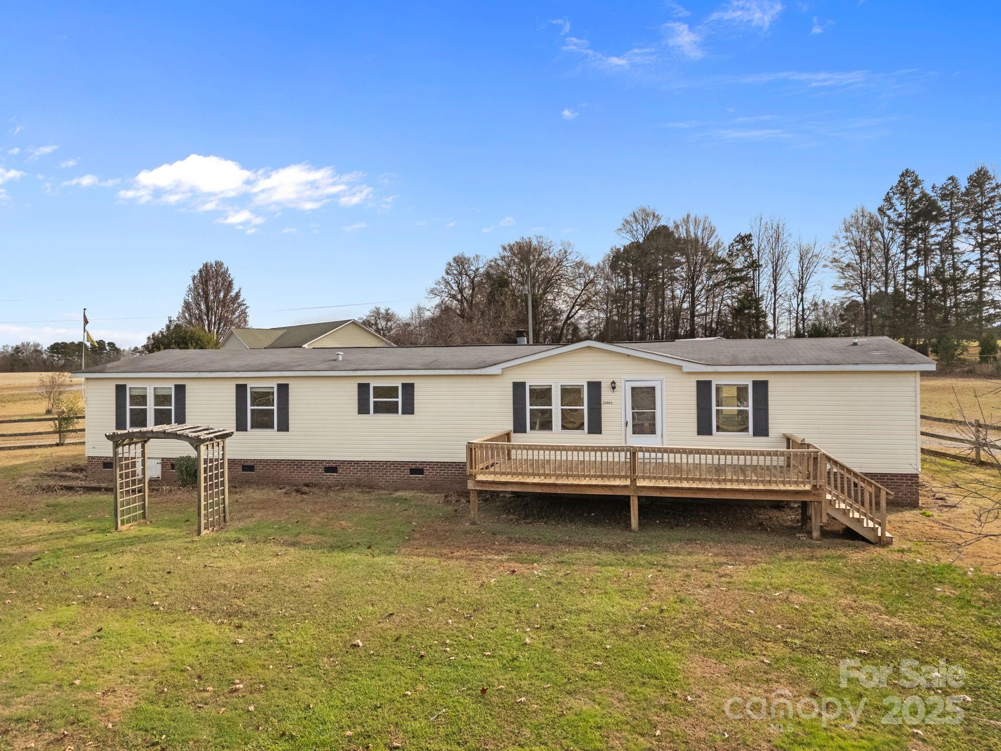 21465 Old Beatty Ford Road Richfield, NC 28137 - Photo 33 of 41 a view of a house with a bed and a yard