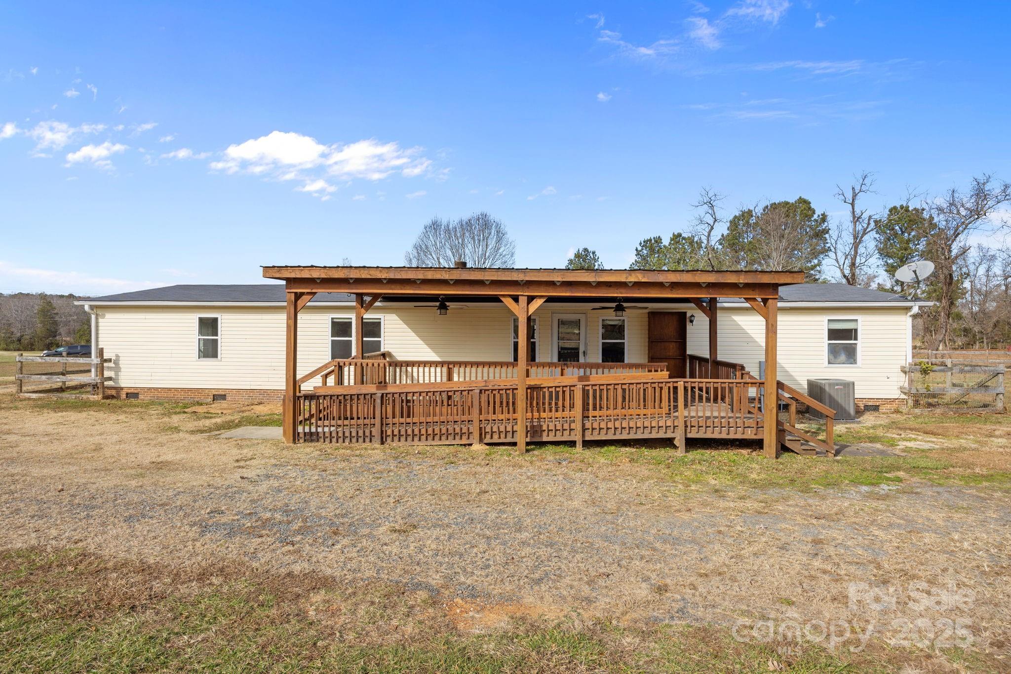21465 Old Beatty Ford Road Richfield, NC 28137 - Photo 34 of 41 a house view with a sitting space and garden space