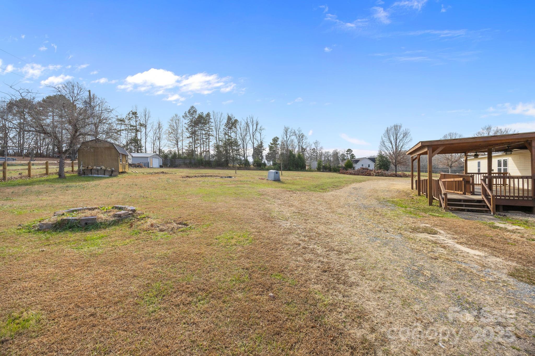 21465 Old Beatty Ford Road Richfield, NC 28137 - Photo 36 of 41 a view of a field with a big yard