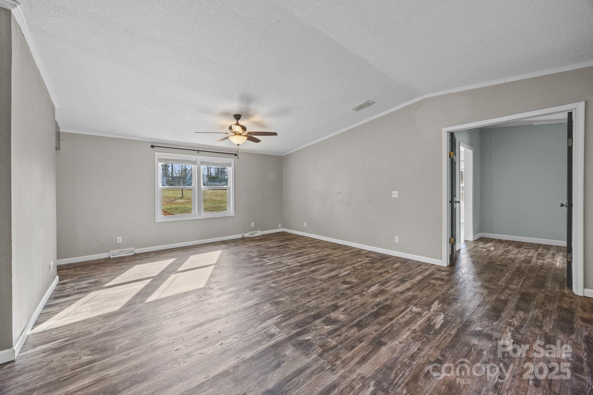 21465 Old Beatty Ford Road Richfield, NC 28137 - Photo 9 of 41 wooden floor in an empty room with a window