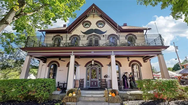 a front view of a house with garden