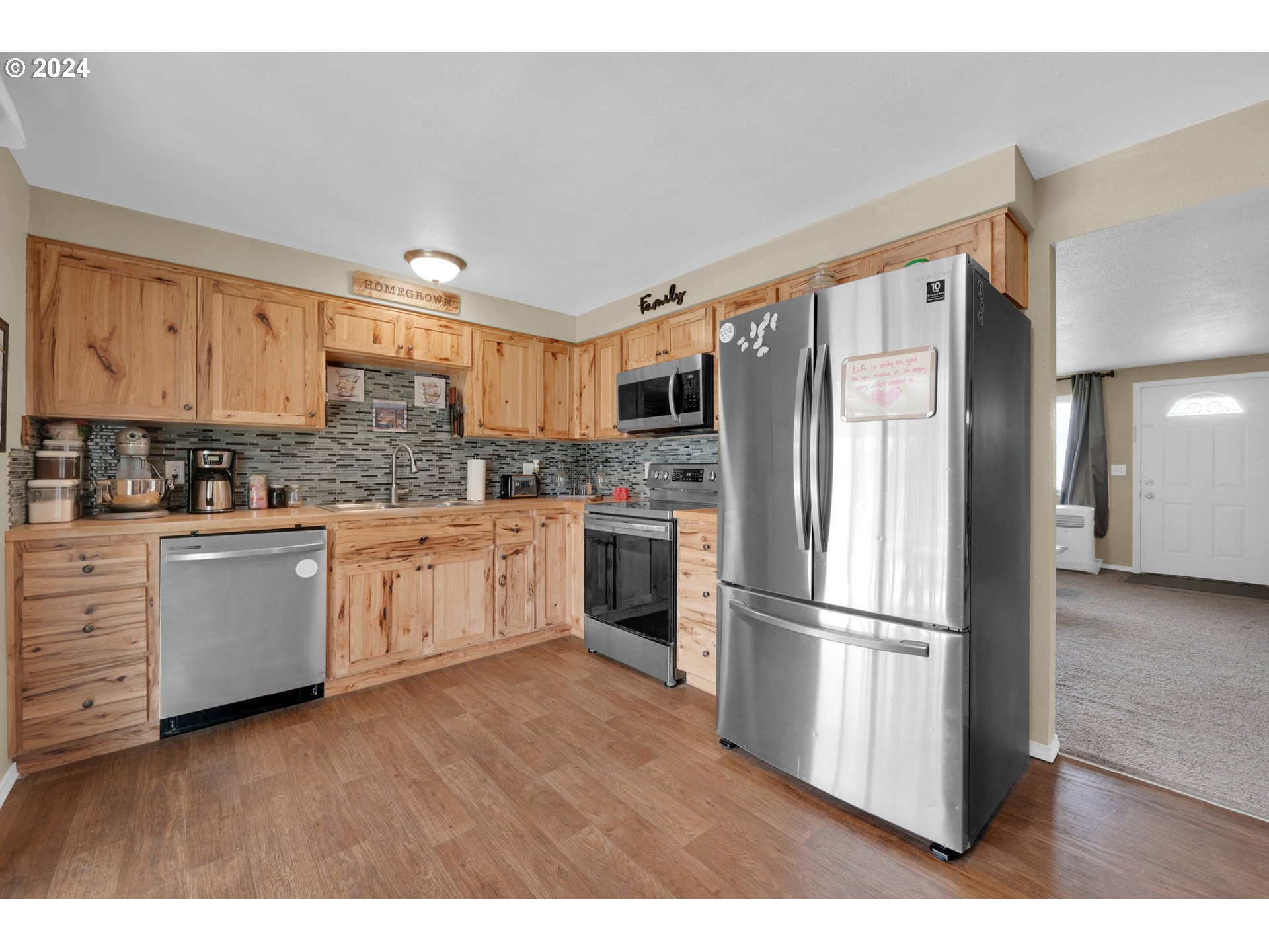 508 37th Street Springfield, OR 97478 - Photo 3 of 27 a kitchen with stainless steel appliances a refrigerator sink and cabinets