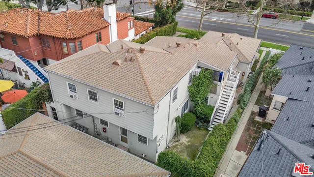 a aerial view of a house with a yard
