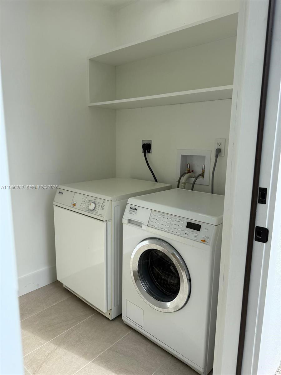 18481 Southwest 208th Street Miami, FL 33187 - Photo 17 of 17 a utility room with dryer and washer