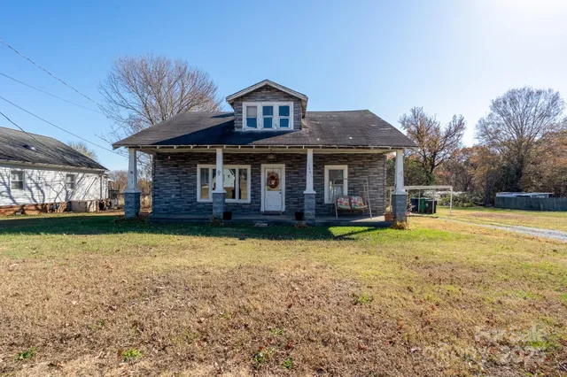 a front view of a house with swimming pool