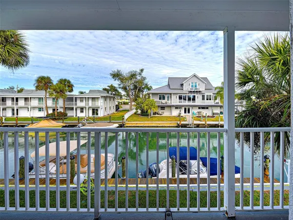 a view of swimming pool with outdoor seating and plants