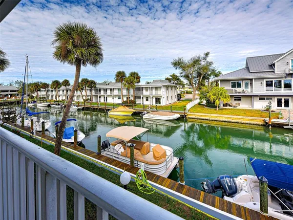 a view of swimming pool with outdoor seating and a garden