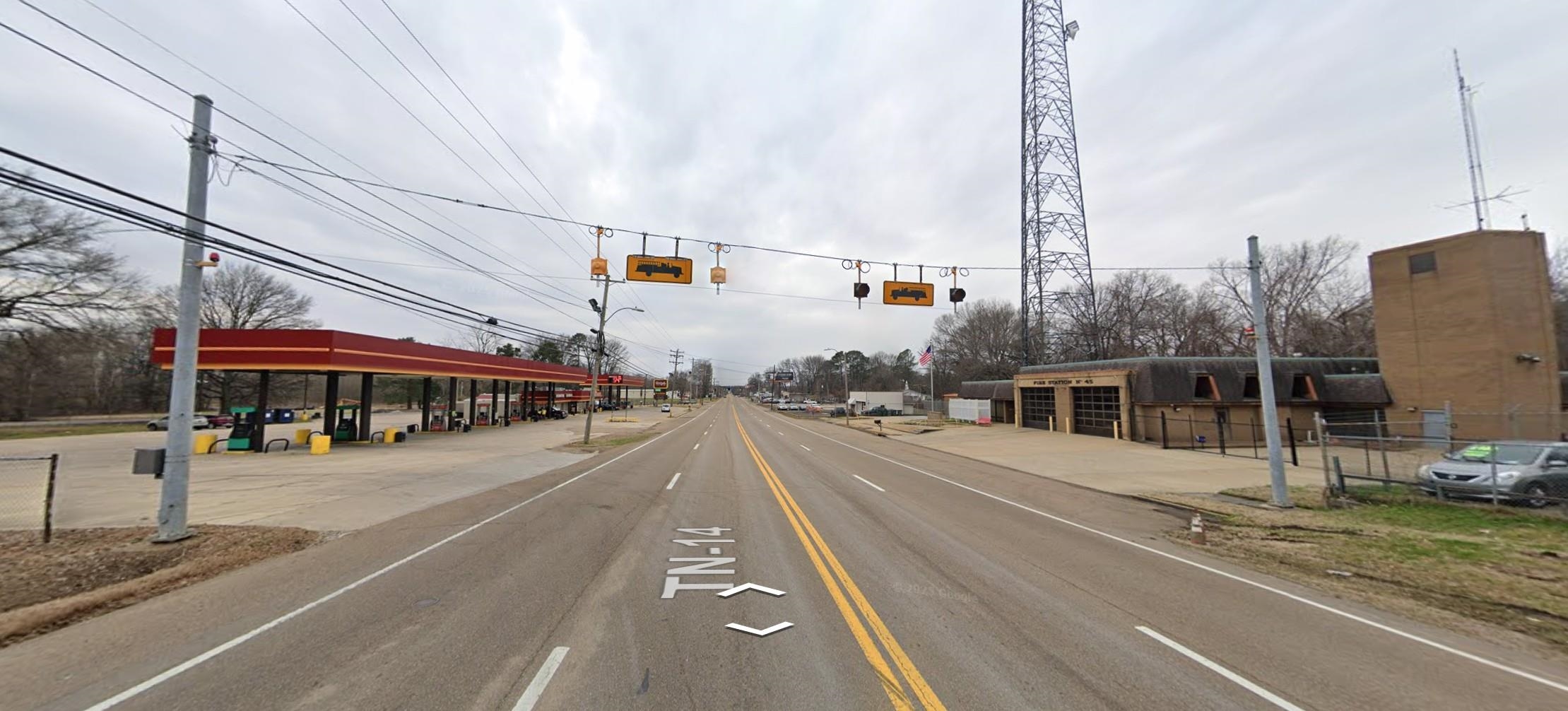 5091 Clinton Road Memphis, TN 38109 - Photo 11 of 12 View of asphalt street featuring traffic lights