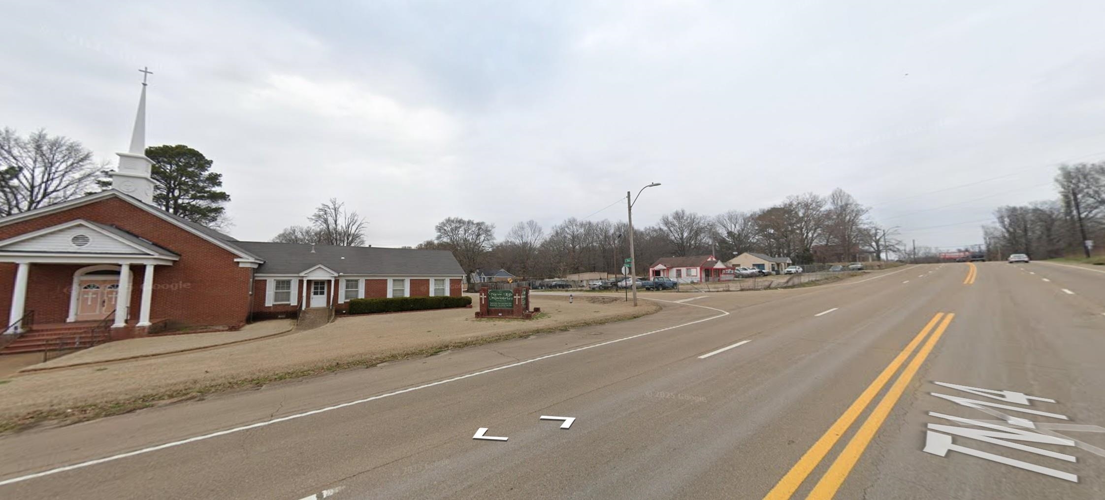 5091 Clinton Road Memphis, TN 38109 - Photo 12 of 12 View of asphalt road with street lighting and a residential view