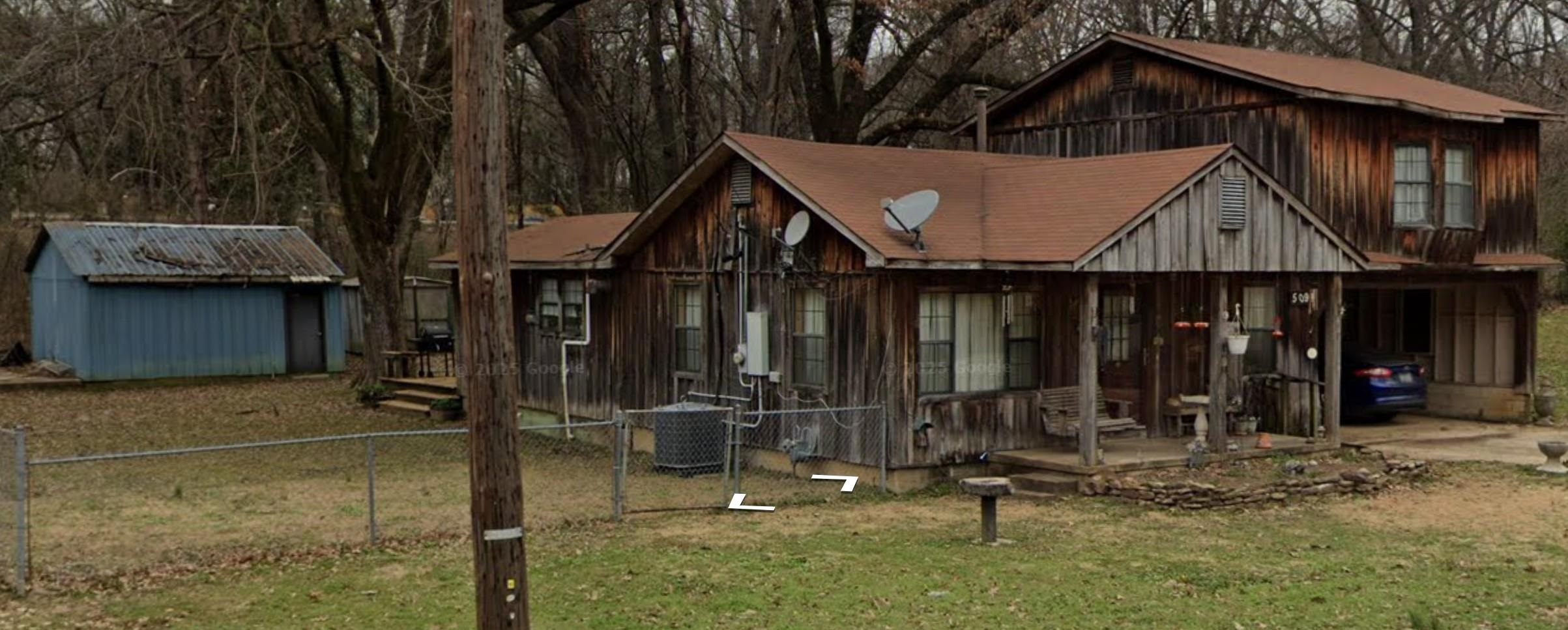 5091 Clinton Road Memphis, TN 38109 - Photo 4 of 12 Back of property featuring covered porch and an outdoor structure