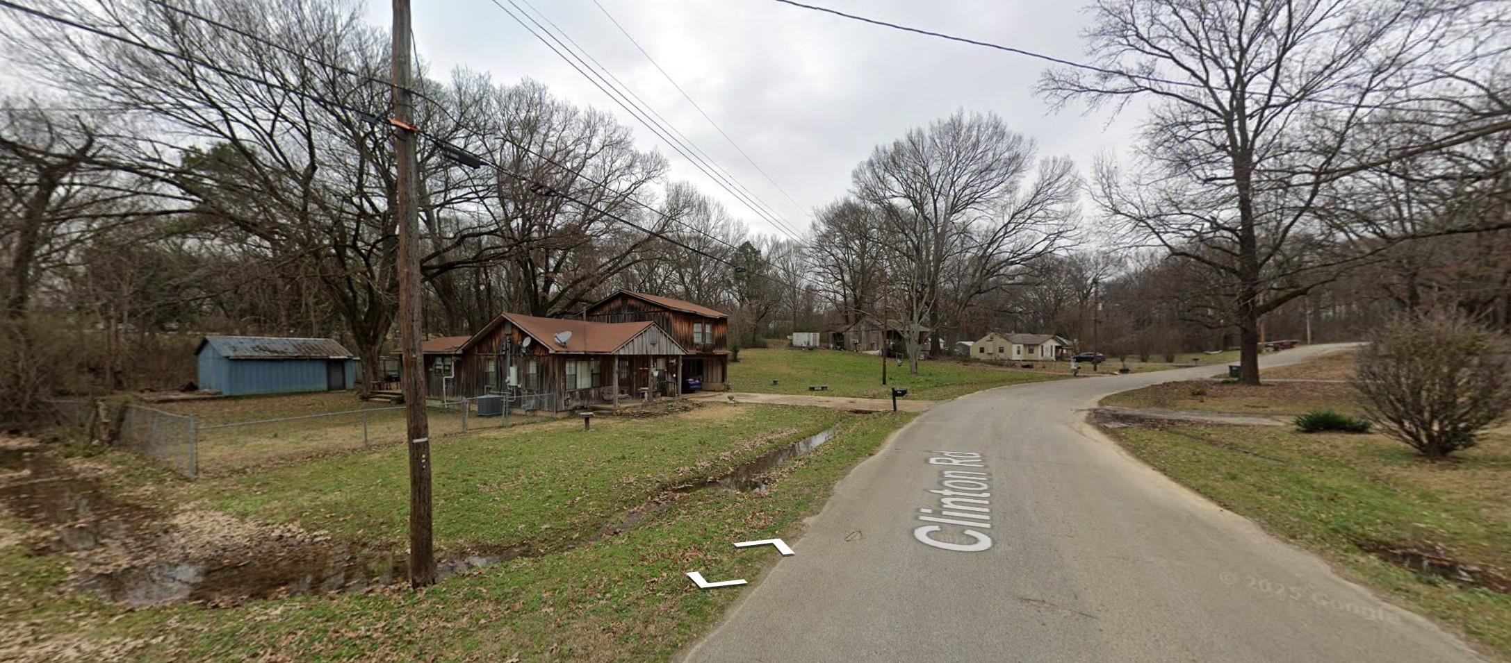 5091 Clinton Road Memphis, TN 38109 - Photo 6 of 12 View of asphalt street featuring view of scattered trees