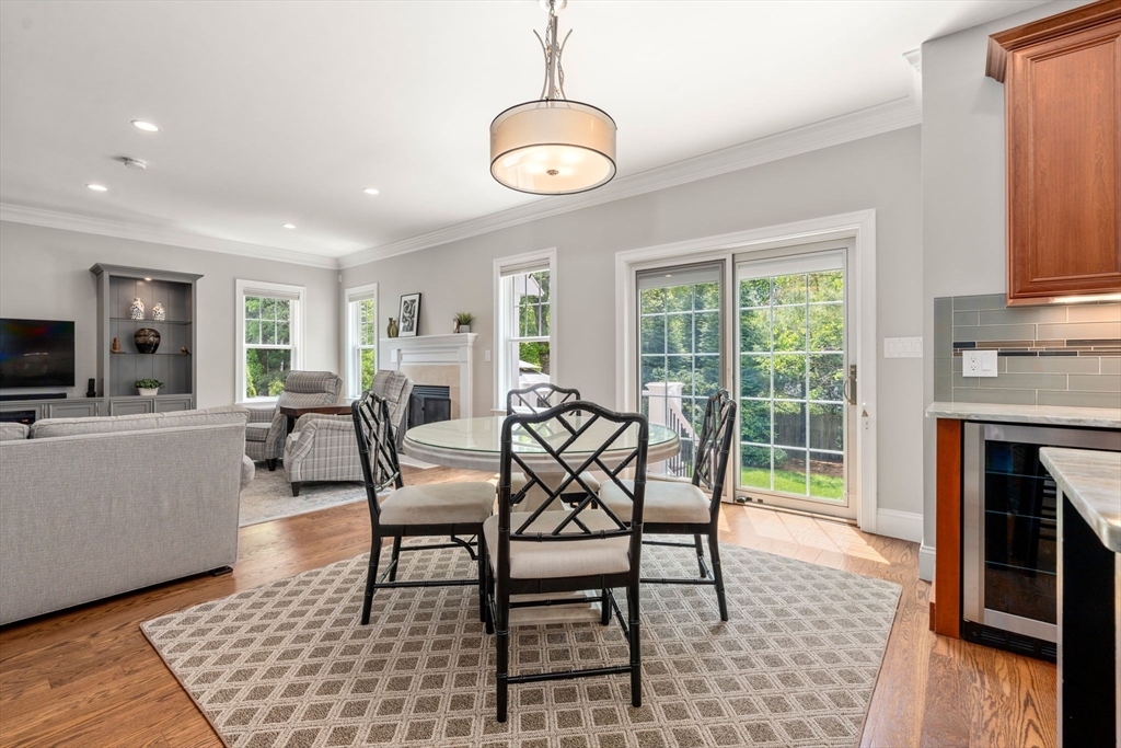 16 Winfield Street Needham, MA 02492 - Photo 11 of 42 a dining room with furniture and a fireplace