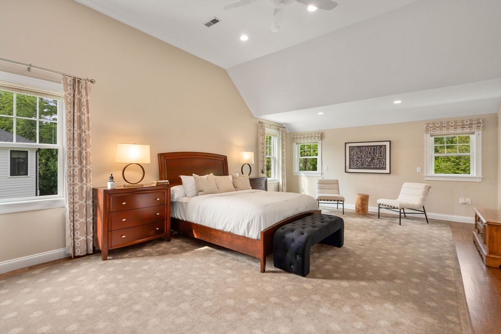 16 Winfield Street Needham, MA 02492 - Photo 17 of 42 a spacious bedroom with a bed and a table