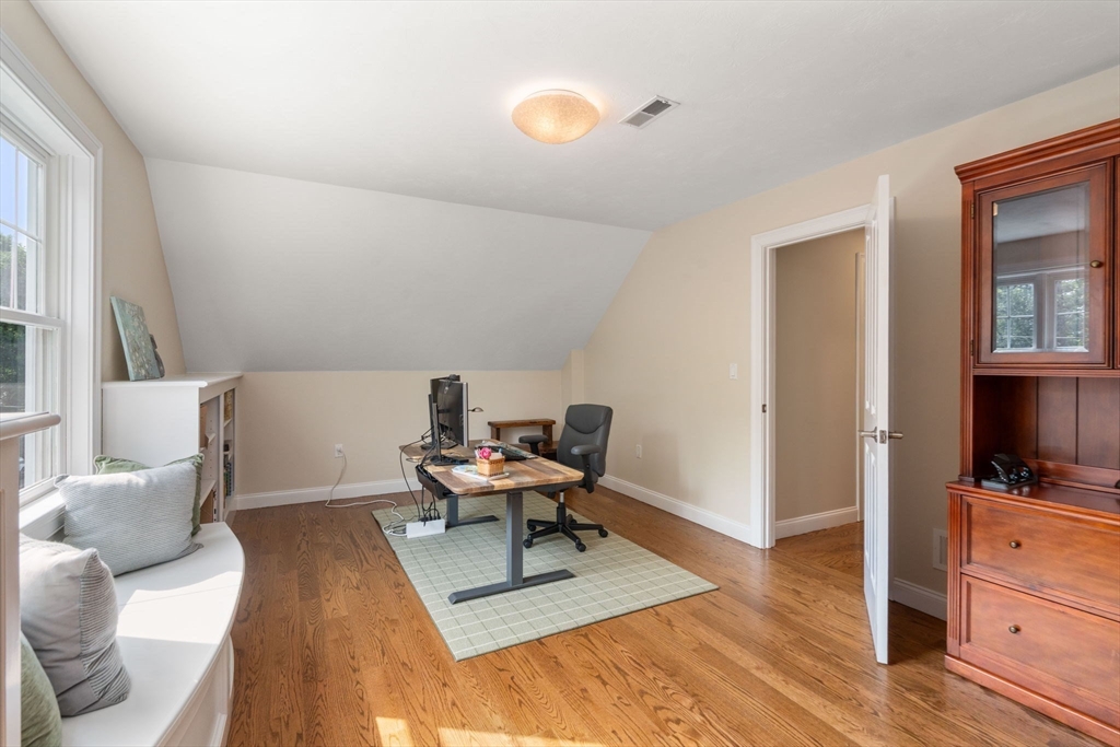 16 Winfield Street Needham, MA 02492 - Photo 22 of 42 a living room with furniture and a flat screen tv