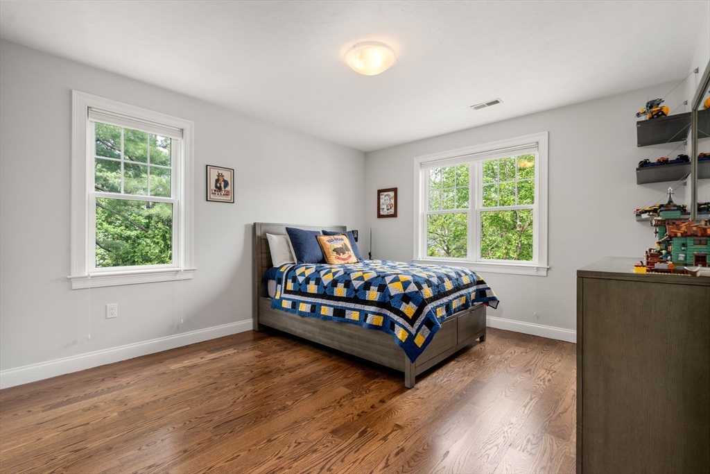 16 Winfield Street Needham, MA 02492 - Photo 24 of 42 a bedroom with a bed window and wooden floor