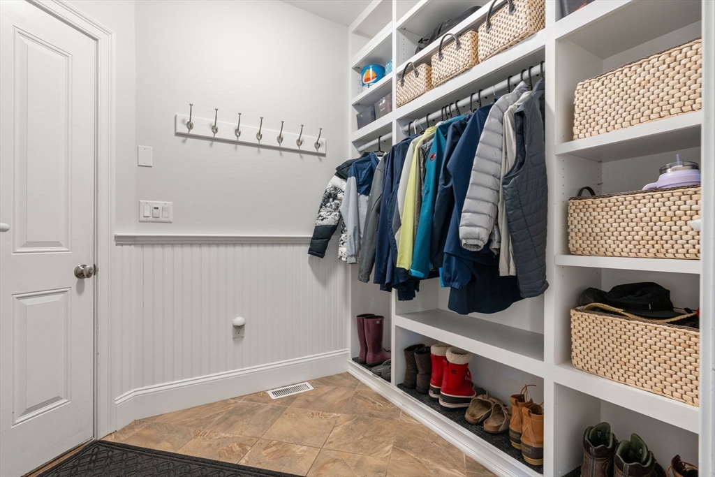 16 Winfield Street Needham, MA 02492 - Photo 36 of 42 a view of walk in closet with clothes and shoes