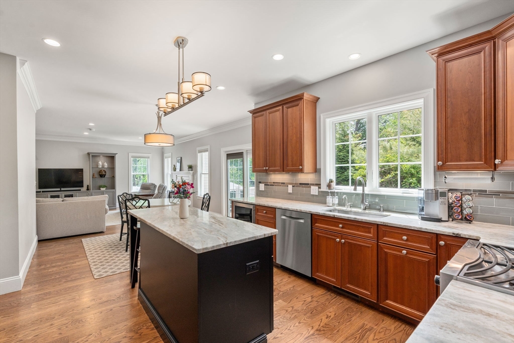 16 Winfield Street Needham, MA 02492 - Photo 6 of 42 a kitchen with granite countertop a sink stove and cabinets
