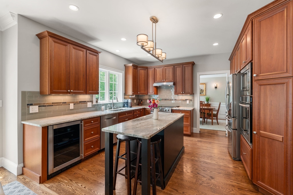 16 Winfield Street Needham, MA 02492 - Photo 7 of 42 a kitchen with counter top space a sink appliances and cabinets