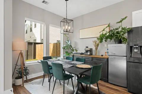 a view of a dining room with furniture window and outside view