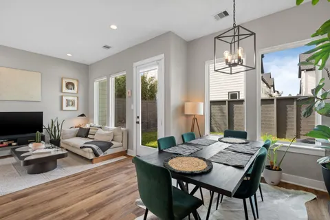a bathroom with a sink mirror and toilet