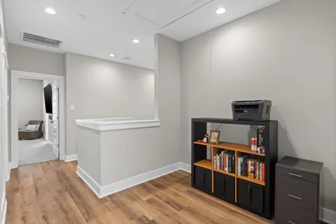 a bedroom with a bed and a couch