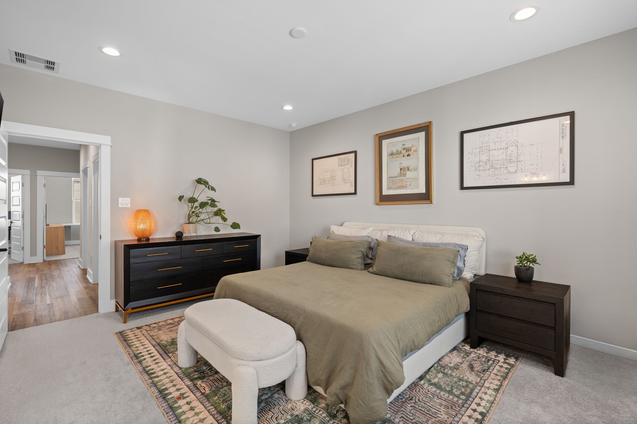 5903 Wheatley Street Houston, TX 77091 - Photo 20 of 32 a bedroom with a bed and wooden floor