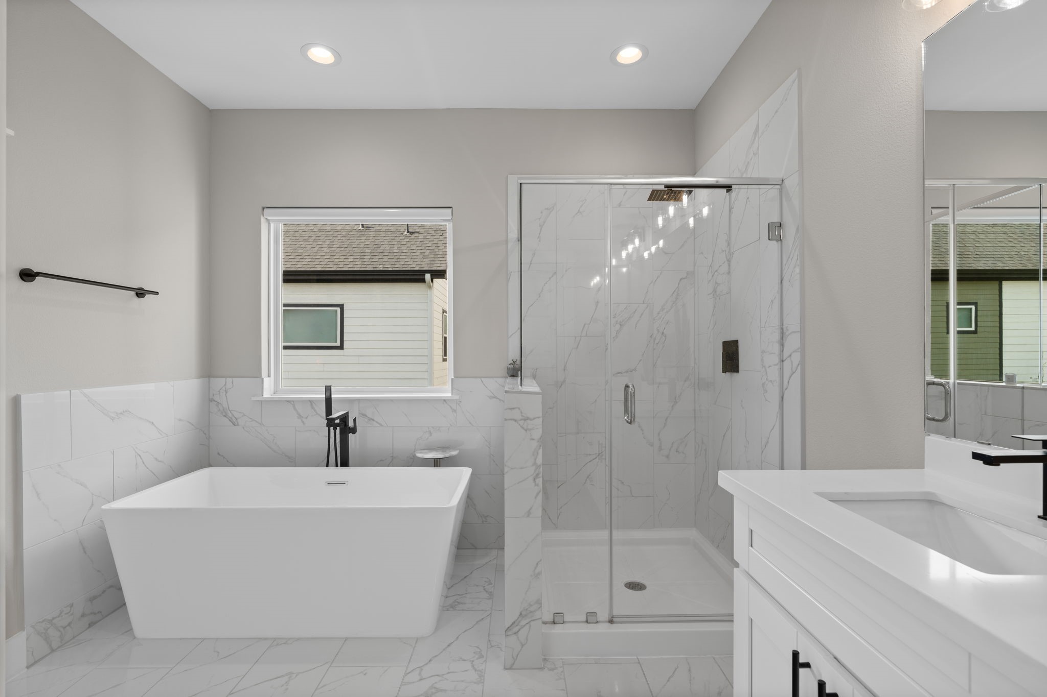 5903 Wheatley Street Houston, TX 77091 - Photo 24 of 32 a bathroom with a bathtub shower sink vanity and toilet
