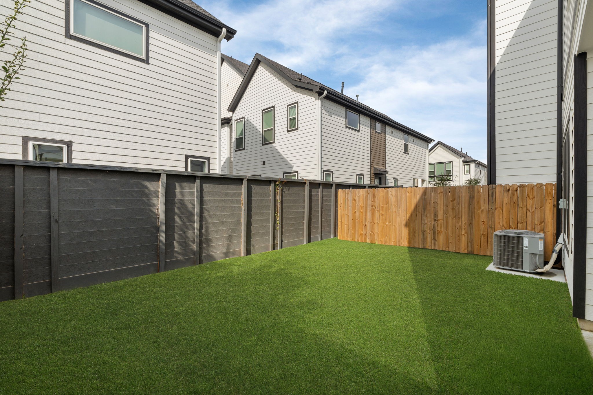 5903 Wheatley Street Houston, TX 77091 - Photo 31 of 32 a front view of a house with a yard