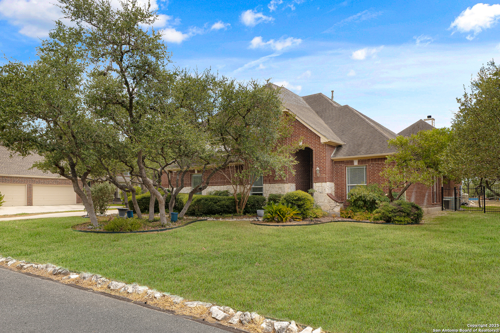 a front view of house with yard and green space