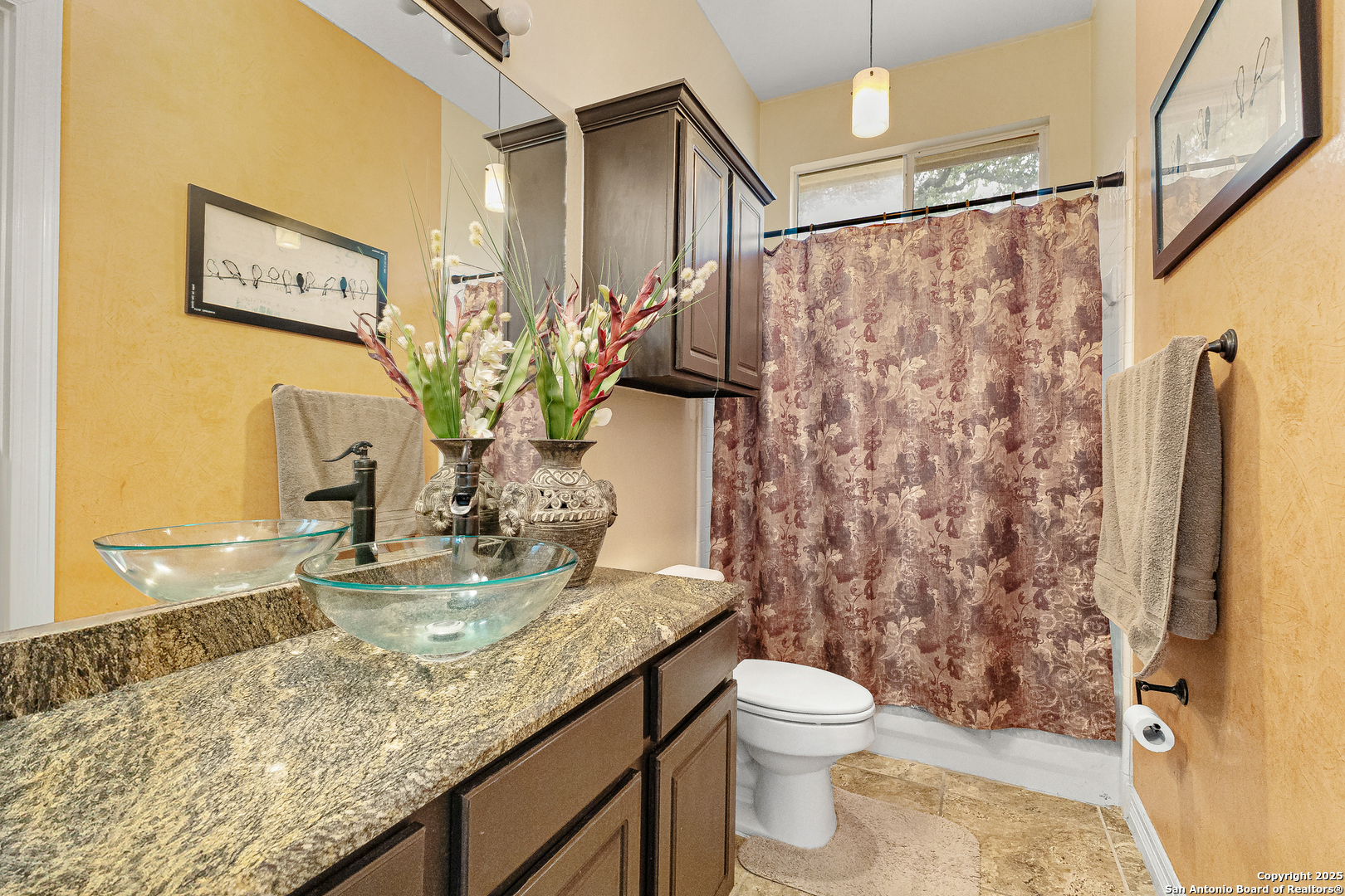 418 Texas Point San Antonio, TX 78258 - Photo 15 of 31 a bathroom with a granite countertop sink a toilet and shower curtain