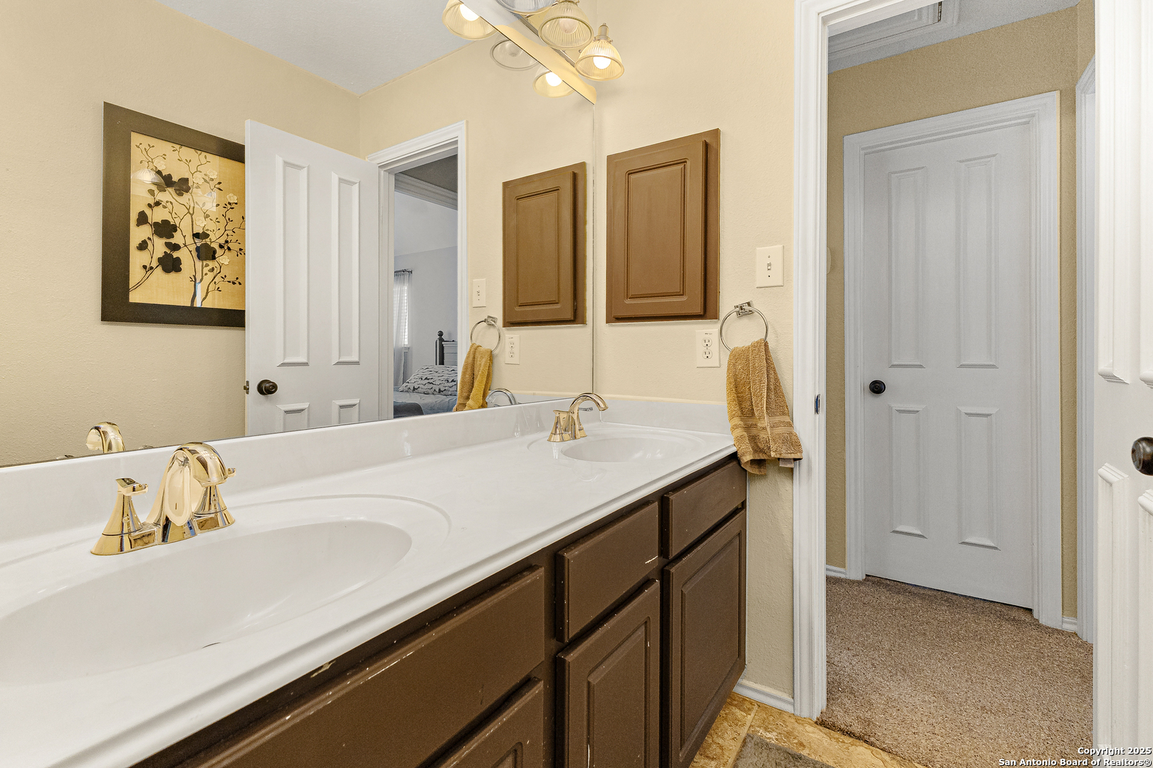 418 Texas Point San Antonio, TX 78258 - Photo 18 of 31 a bathroom with a sink and a mirror