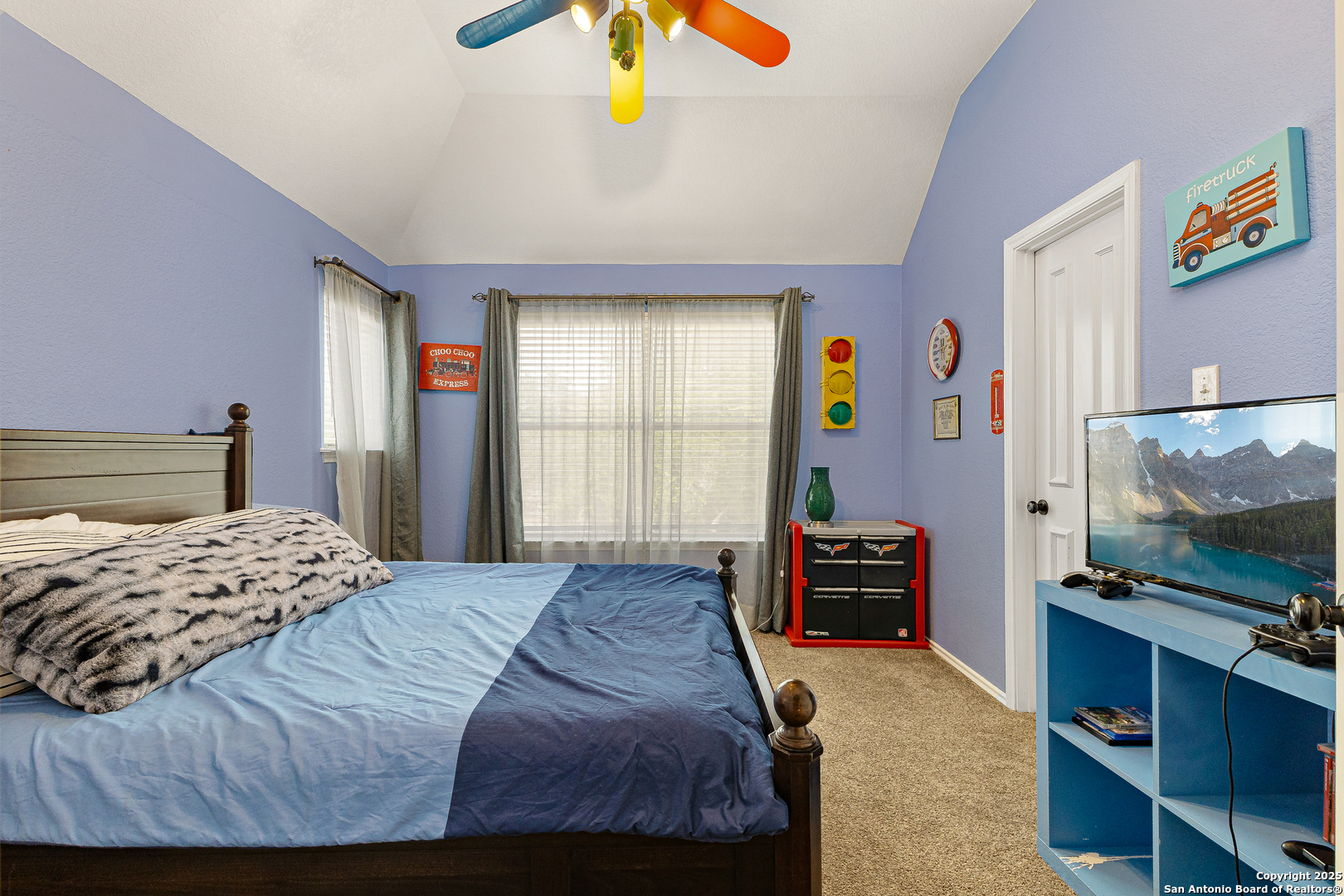 418 Texas Point San Antonio, TX 78258 - Photo 19 of 31 a bedroom with a bed and a flat screen tv