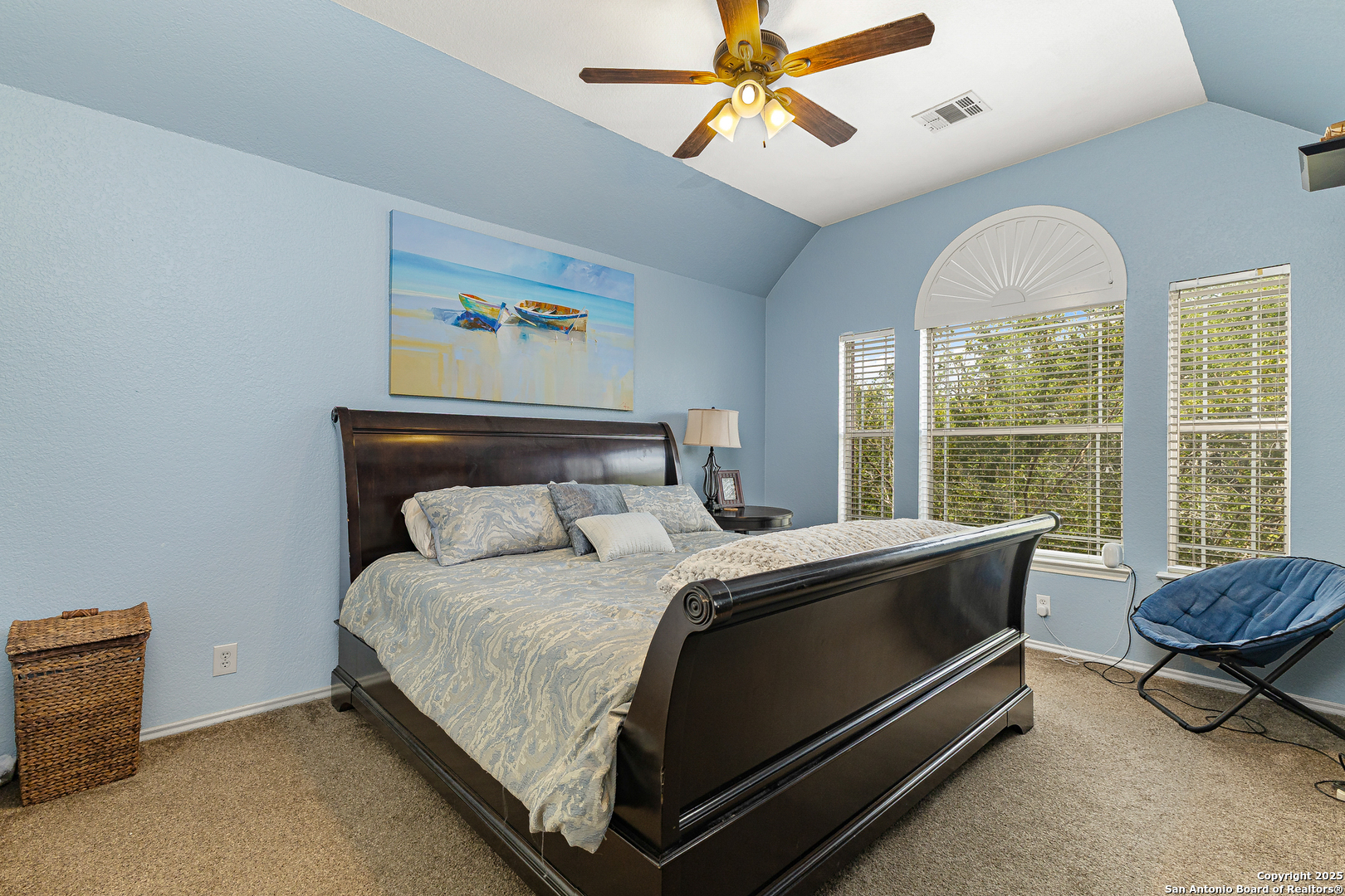 418 Texas Point San Antonio, TX 78258 - Photo 20 of 31 a bedroom with a bed and a chandelier