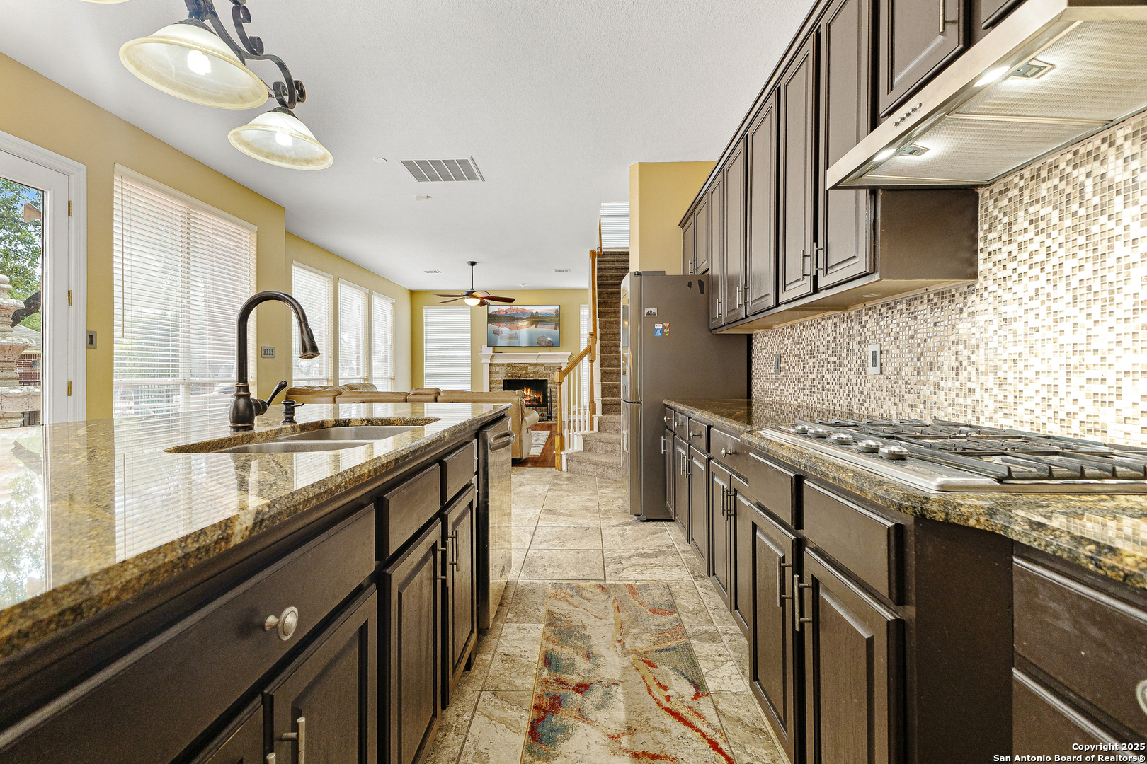 418 Texas Point San Antonio, TX 78258 - Photo 7 of 31 a kitchen with stainless steel appliances granite countertop a stove and a sink