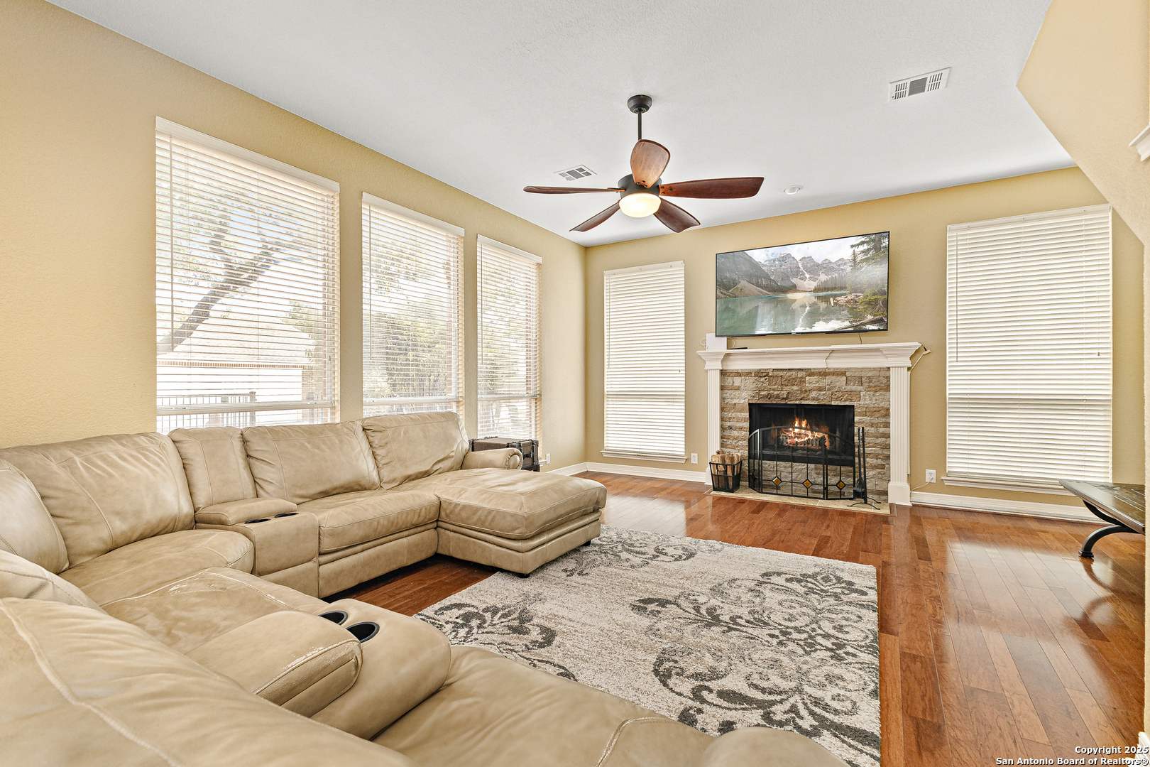 418 Texas Point San Antonio, TX 78258 - Photo 9 of 31 a living room with furniture and a fireplace