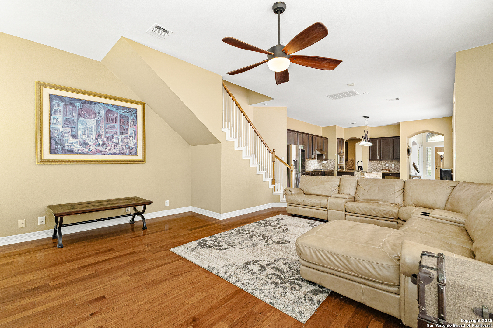 418 Texas Point San Antonio, TX 78258 - Photo 10 of 31 a large bedroom with a bed and a chandelier