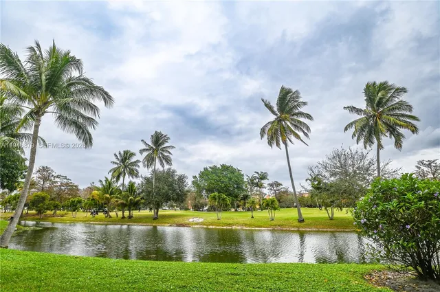 a view of lake with green space