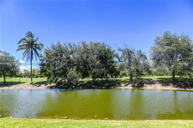 a view of a garden with a house