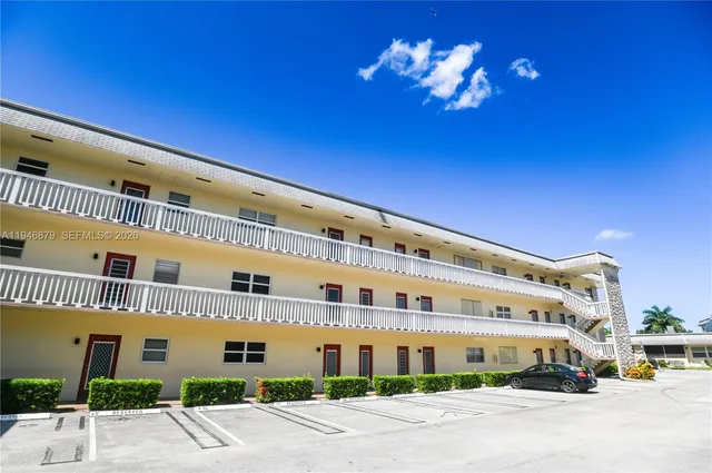 a view of a park with large trees