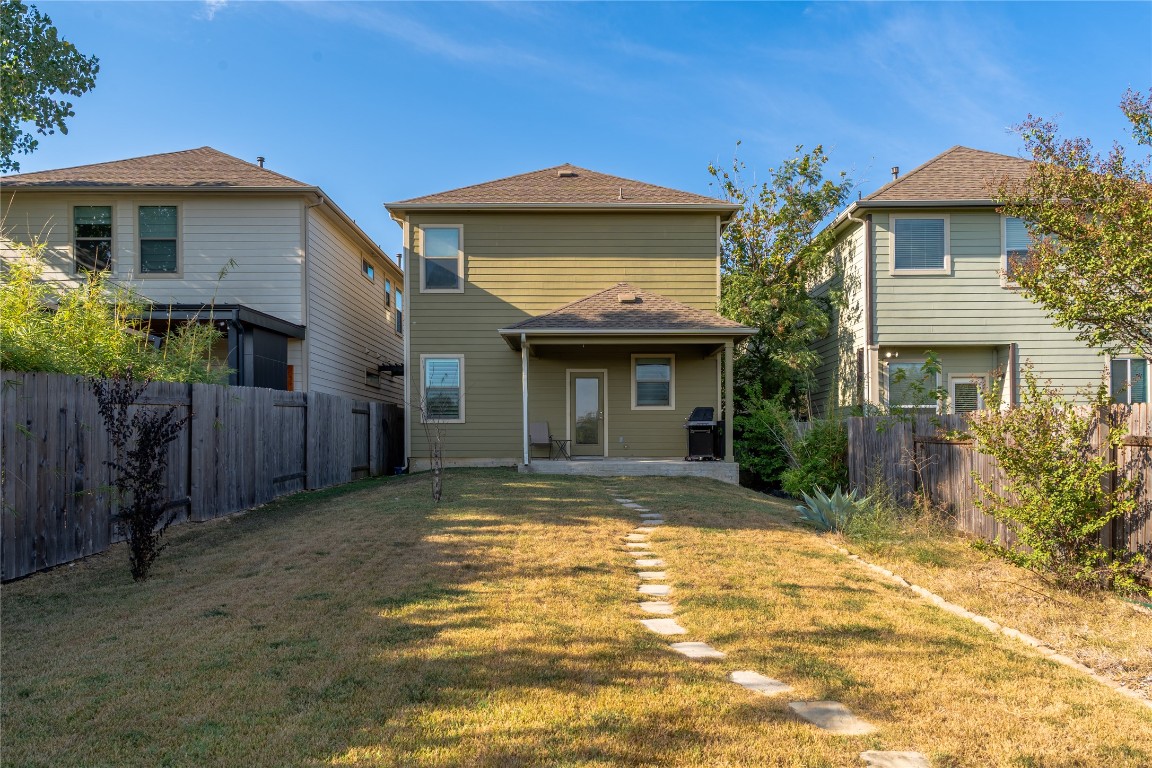 3006 Sea Jay Drive Austin, TX 78745 - Photo 18 of 22 Rear view of property with a patio area and a fenced backyard