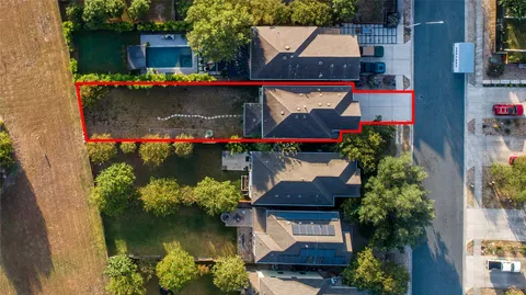 an aerial view of house with yard swimming pool and outdoor seating